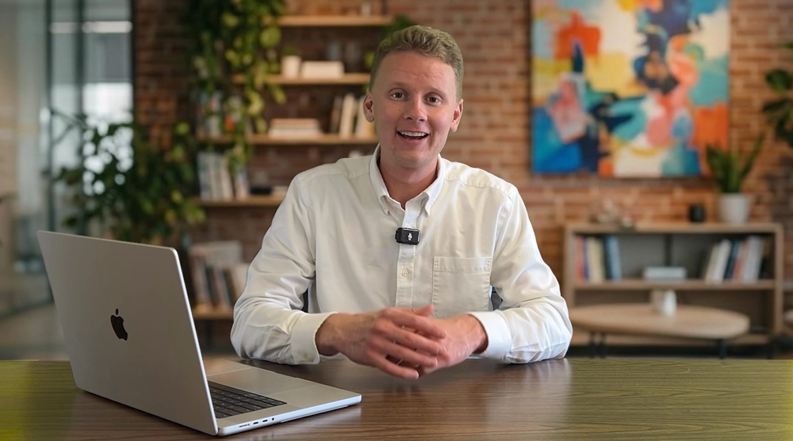 Jake Grim at a laptop, explaining a website build