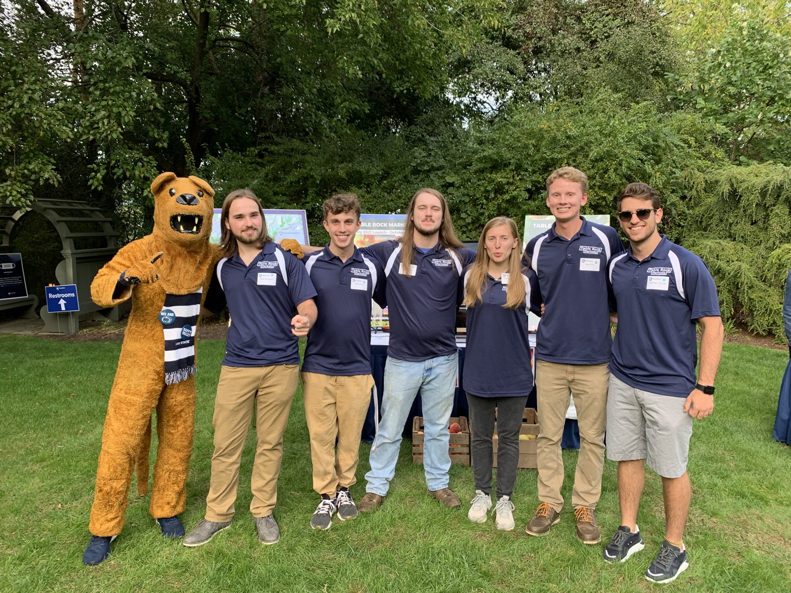 The Table Rock Markets team with the Nittany Lion mascot at Penn State